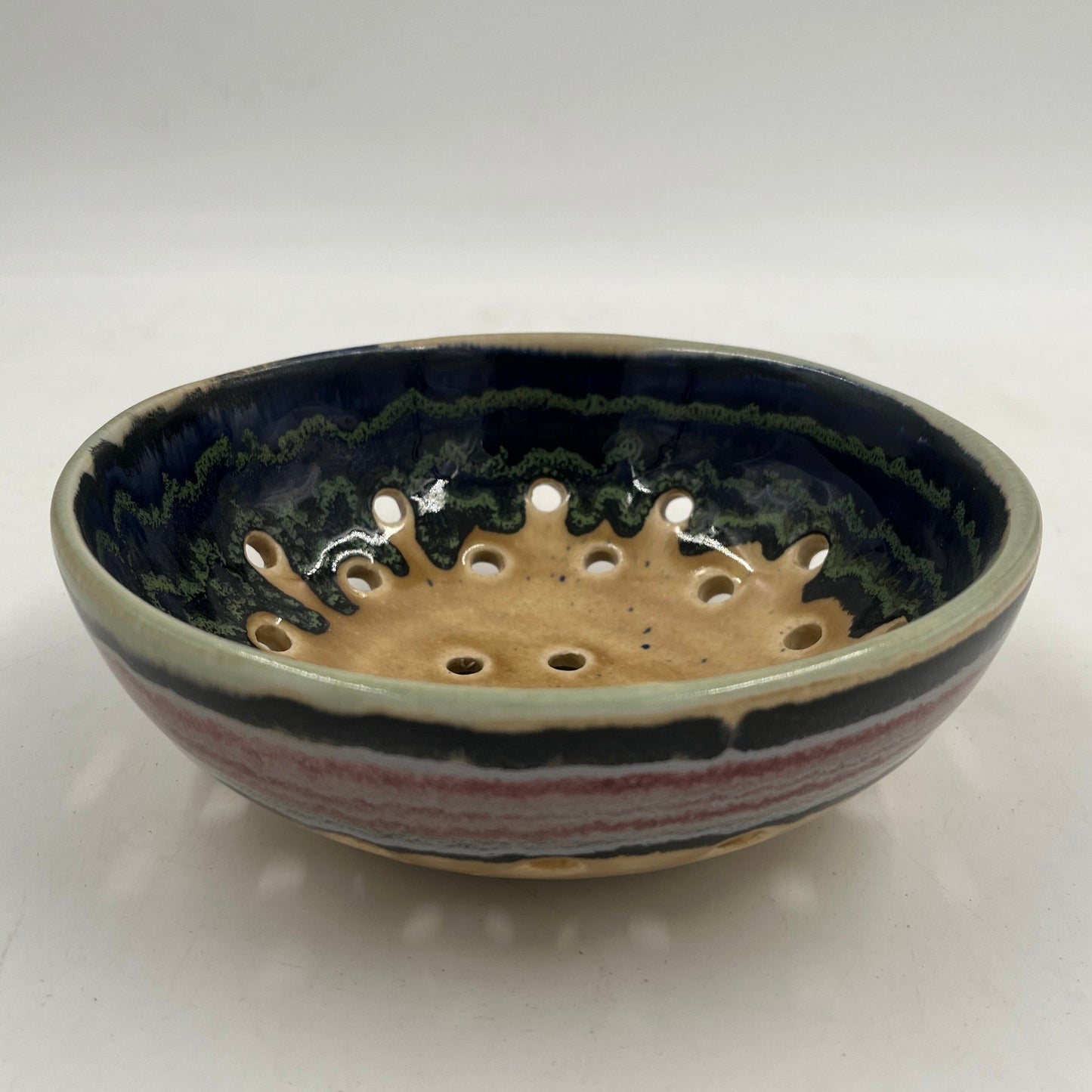 Ceramic bowl with decorative patterns on a white background