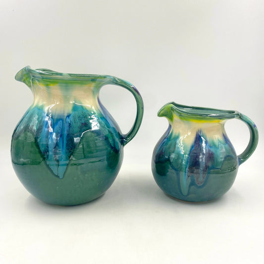 Large and small teal pitchers